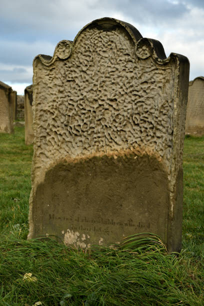 istock Heavily weathered gravestone at Whitby, UK. 1053207764