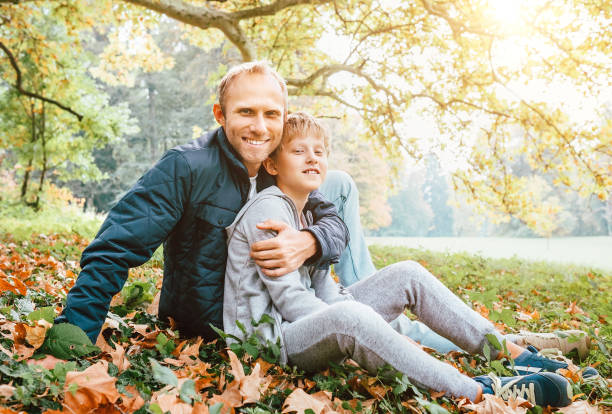 istock Father and son autumn portrait 1053208602