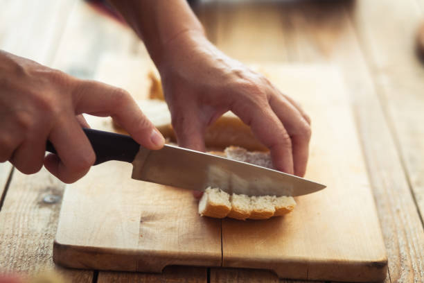 istock Snack food, making of crouton, bread chopping 1053211350