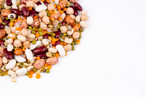 istock Mixed dried legumes and cereals isolated on white background, top view 1053220110