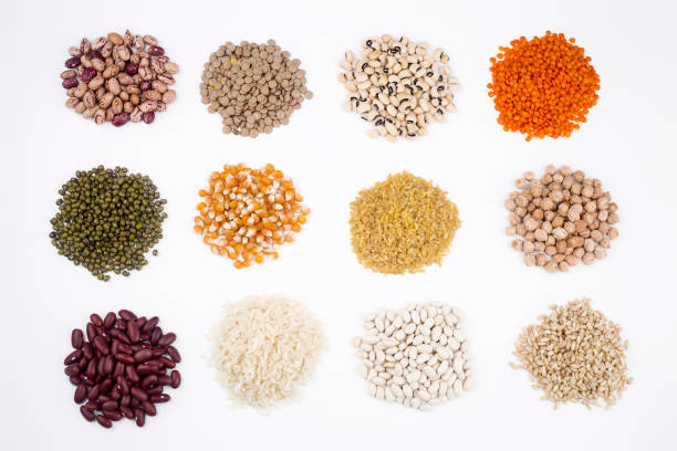 istock Mixed dried legumes and cereals isolated on white background, top view 1053220392