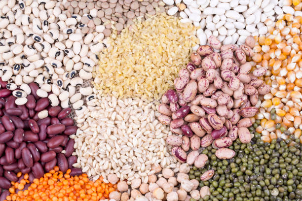 istock Mixed dried legumes and cereals isolated on white background, top view 1053222732