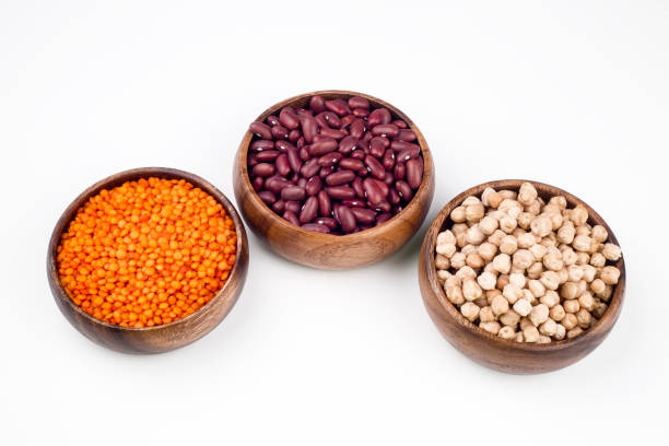 istock Mixed dried legumes and cereals isolated on white background, top view 1053222854