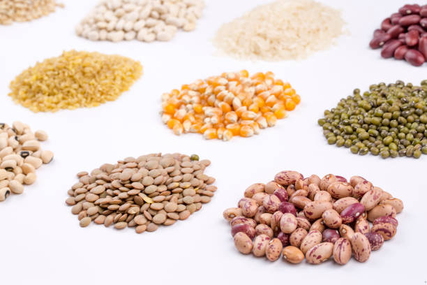istock Mixed dried legumes and cereals isolated on white background, top view 1053222902