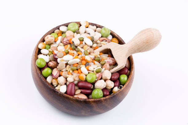 istock Mixed dried legumes and cereals isolated on white background, top view 1053222948