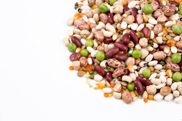 istock Mixed dried legumes and cereals isolated on white background, top view 1053222950