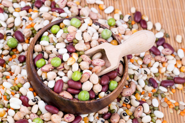 istock Mixed dried legumes and cereals isolated on white background, top view 1053222968