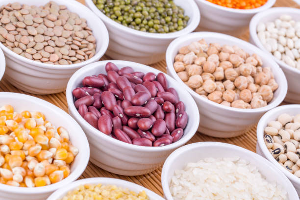 mixed dried legumes and cereals isolated on white background, top view - 13427 imagens e fotografias de stock