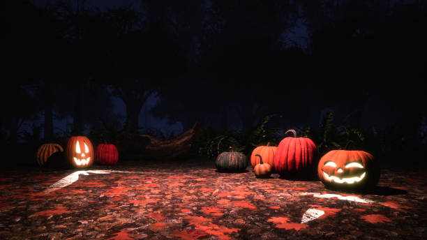 istock Carved halloween pumpkins in misty night forest 1053223244