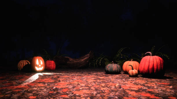 istock Scary halloween pumpkins in autumn forest at night 1053223300