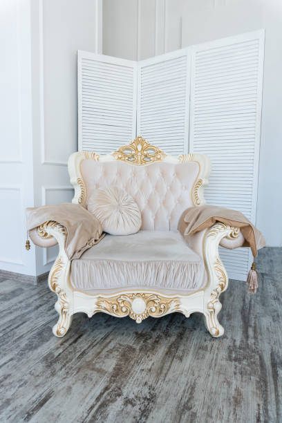 istock luxurious expensive armchair on a white wall background in an empty room 1053226896