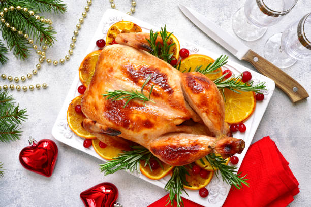 istock Roasted chicken with oranges ,rosemary and cranberries 1053228992