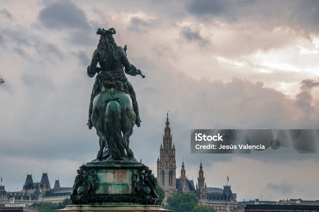 Equestrian Prince Eugene Vienna Equestrian statue of Prince Eugene of kale back in Neue Burg the Austrian National Library, with the Vienna City Hall in the background. Austria Stock Photo
