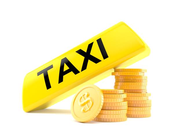 istock Taxi light with stack of coins 1053234596