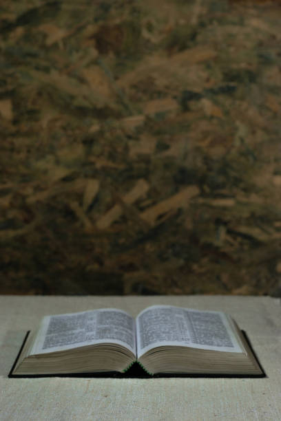 istock Bible on an old table. Beautiful background. Religion concept. 1053235174