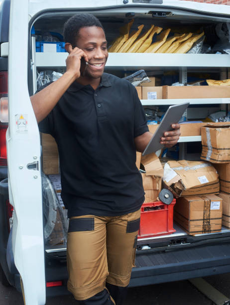 istock Tradesman on the phone checking parts order 1053252284