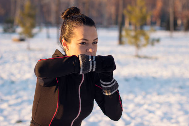 istock Woman exercising on cold winter day 1053259868