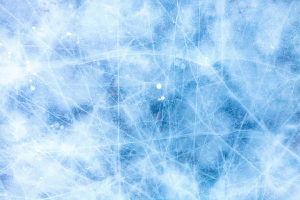 istock texture of a beautiful blue ice with cracks 1053261216