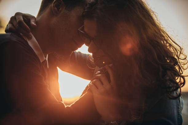 istock Couple sharing love in sunset 1053267684