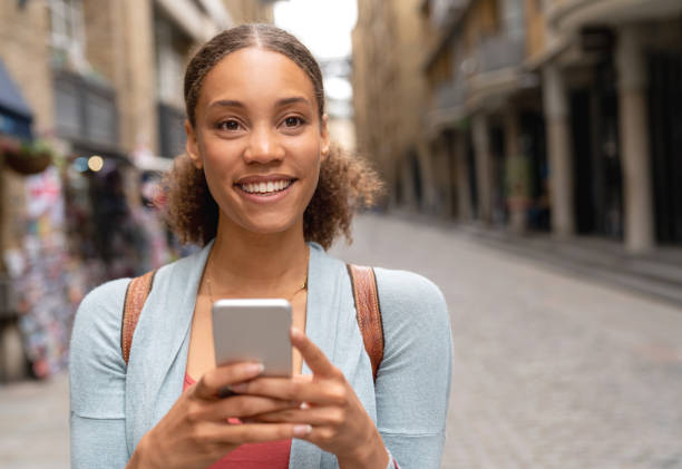 istock Woman texting on her cell phone 1053289446