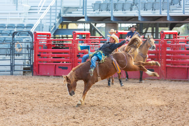 istock Cowboys Competing in the Bucking Bronco Event at a Rodeo 1053298622