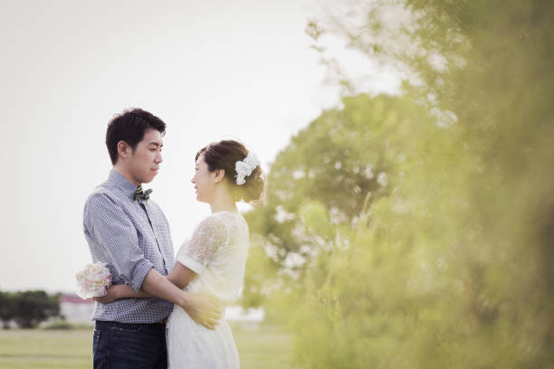istock Couple embracing in the park 1053299274