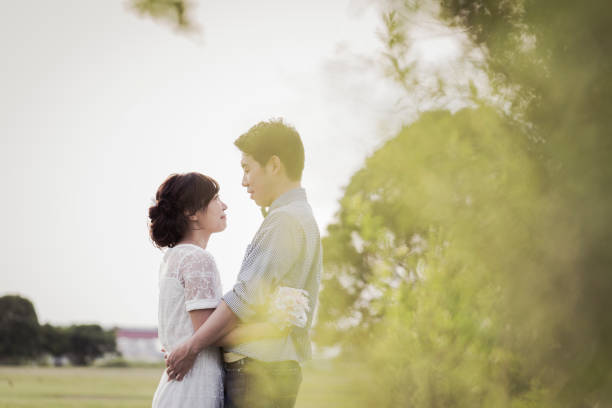 istock Couple embracing in the park 1053299288