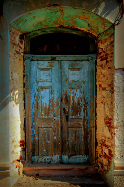 istock Old fashioned stone house wood door 1053304642