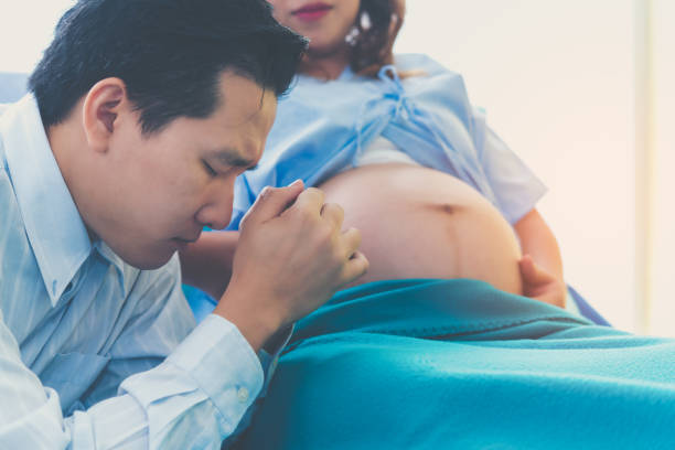 The man is a husband worried about his wife's pregnancy, childbirth greatly. stock photo