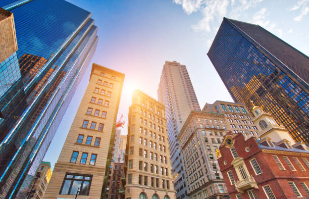 Boston downtown streets near Old State House at sunset Boston downtown streets near Old State House at sunset architecture built structure building exterior church stock pictures, royalty-free photos & images