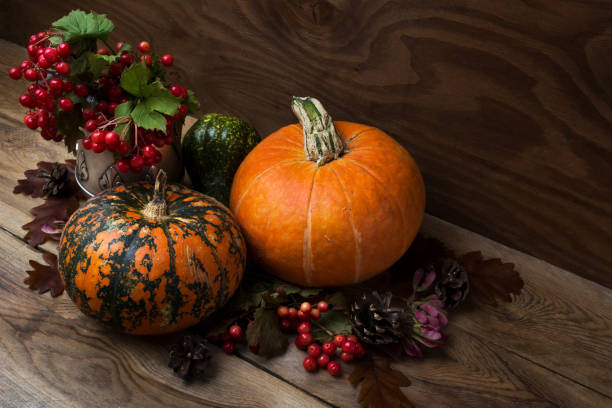 istock Fall table centerpiece with viburnum and pumpkins 1053315510