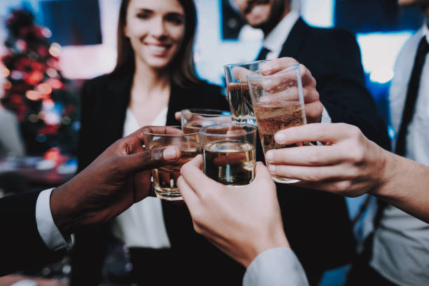 istock Young People Celebrating New Year in Modern Office 1053317782