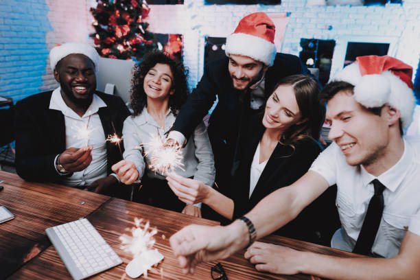 istock Young People Celebrating New Year in Modern Office 1053317812