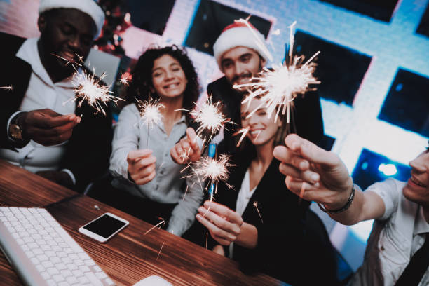 istock Young People Celebrating New Year in Modern Office 1053317826