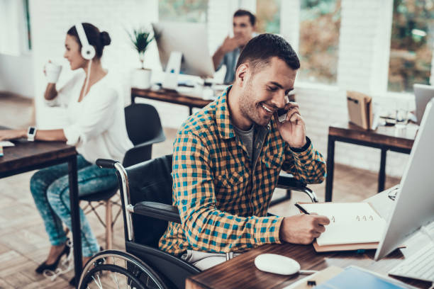 man on wheelchair write notes and talking on phone - house pen people caucasian imagens e fotografias de stock