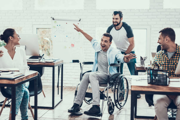 istock Happy Workers Have Fun on Break in Modern Office. 1053318734