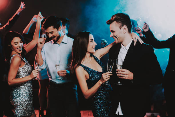 istock Happy Young People Dancing on New Year Party. 1053321158