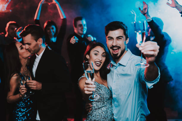 istock Happy Young People Dancing on New Year Party. 1053321162