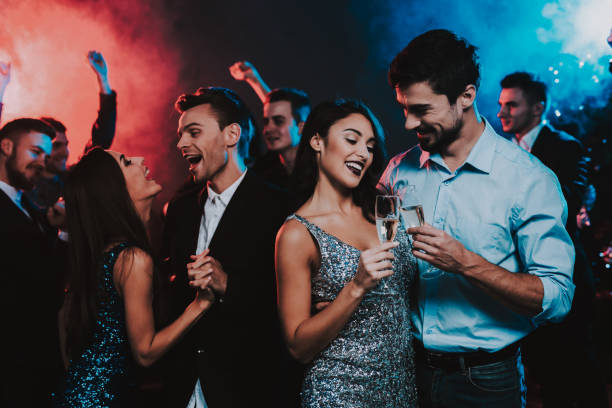 istock Happy Young People Dancing on New Year Party. 1053321164