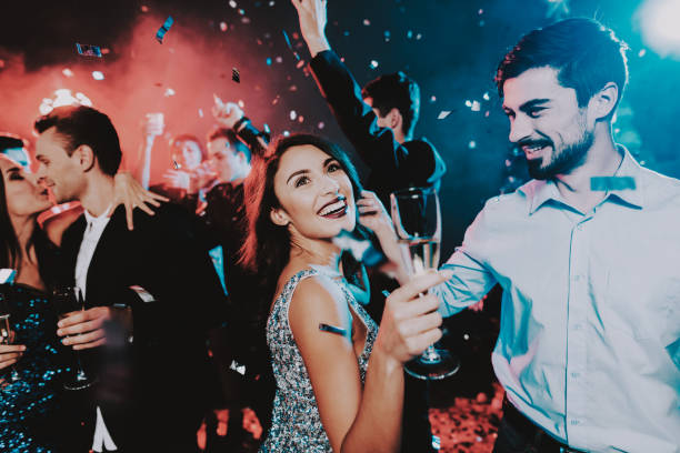istock Happy Young People Dancing on New Year Party. 1053321192