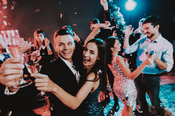 istock Happy Young People Dancing on New Year Party. 1053321196