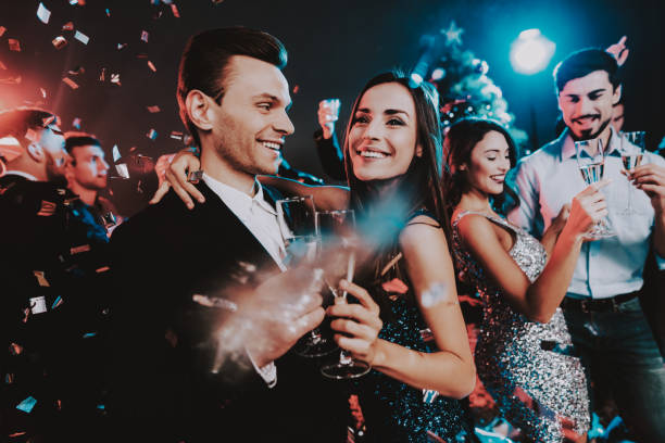 istock Happy Young People Dancing on New Year Party. 1053321202