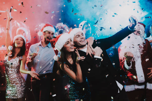 istock Happy People Taking Selfie on New Year Party. 1053322410