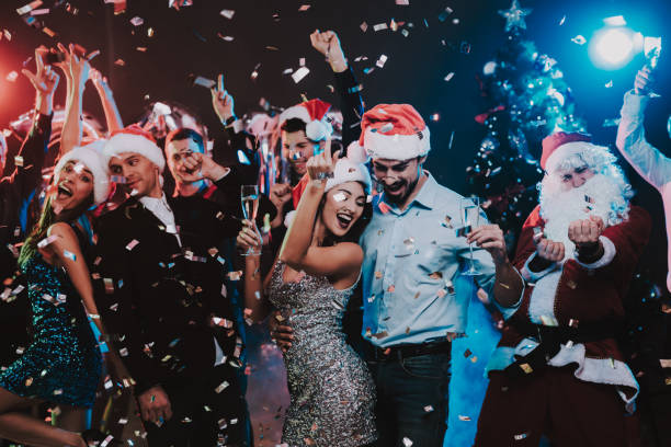 istock Happy Young People Dancing on New Year Party. 1053322436