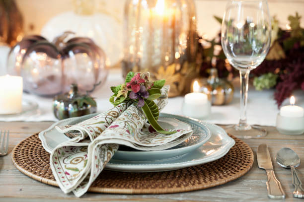istock Autumn Thanksgiving dining table place setting on an old wood rustic table 1053325002