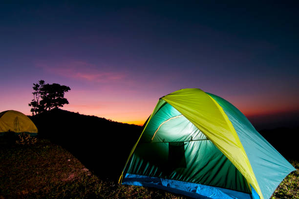 istock Camp in the mountains with  sunset sky. 1053325022