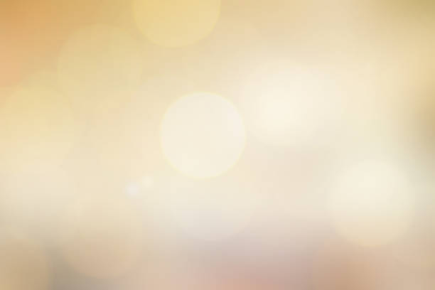 istock abstract blur soft glowing yellow color background with double exposure bokeh light for happy new tear and merry christmas celebration festival design element concept 1053327740