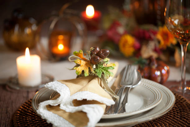 istock Autumn Thanksgiving dining table place setting on an old rustic wood rustic table 1053329114