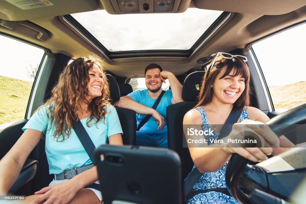 friends in car. road trip friends in car. road trip. view from inside, wide angel Car Stock Photo