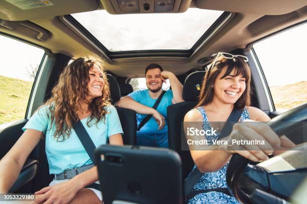 Friends In Car Road Trip Stock Photo - Download Image Now - Car, Friendship, Driving